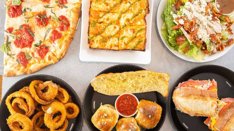 Pizza, Detroit style pizza, a salad, onion rings, garlic bread and a grinder from On Point Pizza
